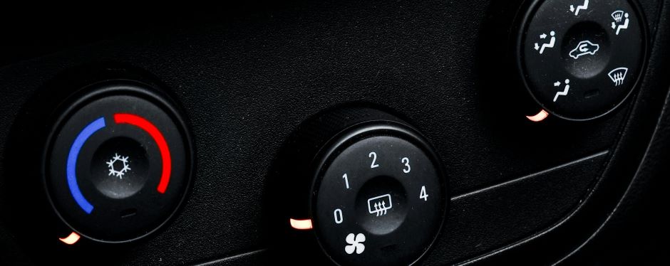 close up of car AC dials